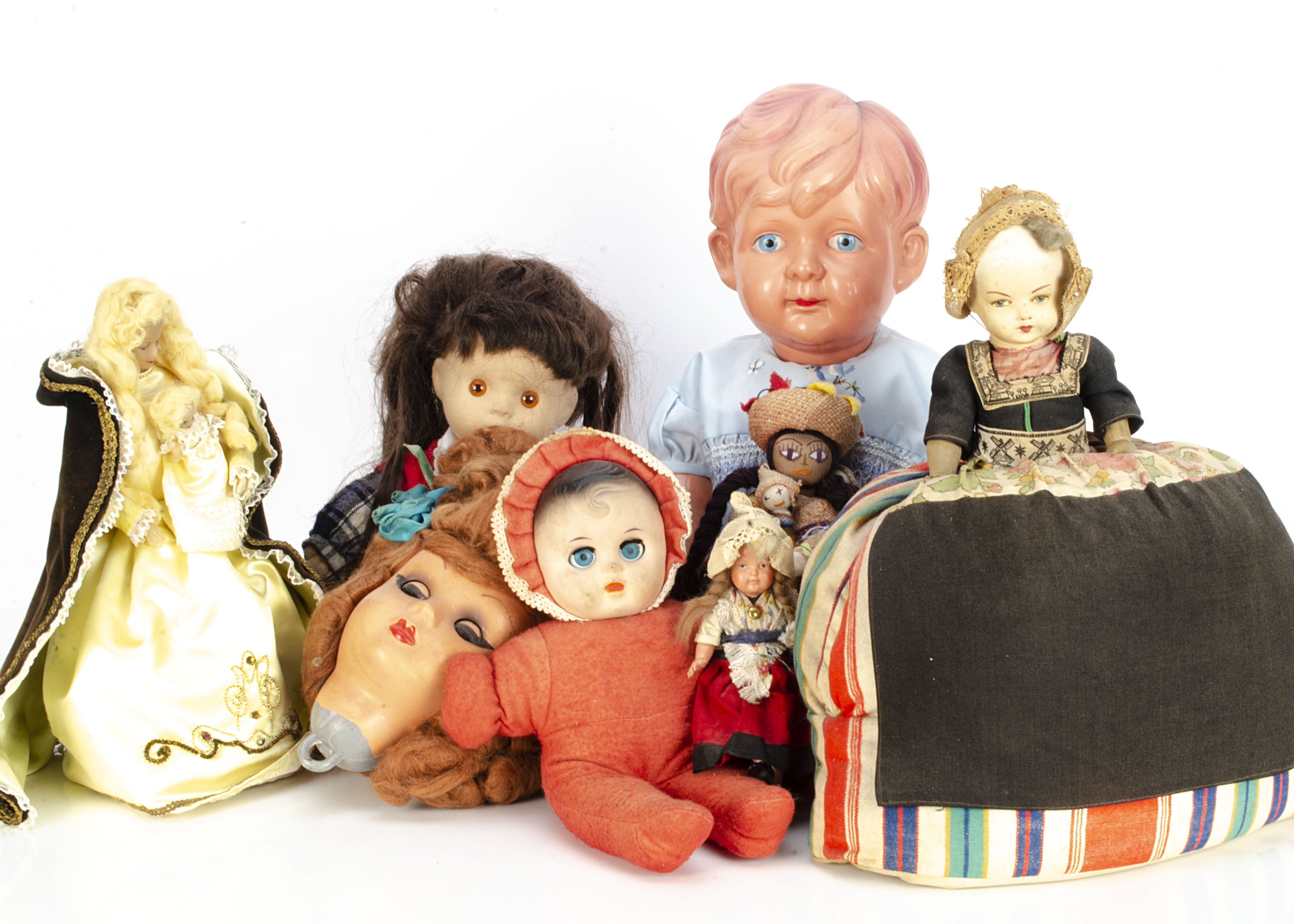 Various dolls, a Japanese air-blown boy doll --23cm. (58.5cm.) high; a composition headed tea