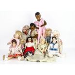 A quantity of cloth dolls, including a Norah Wellings jointed girl doll, probably redressed with