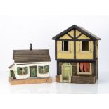 Two small dolls' houses, Tudor House, a two storey mock Tudor house with walled front garden and
