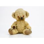 A Merrythought Cheeky teddy bear 1960s, with golden mohair, orange and black plastic eyes, inset