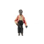 A 19th century American black jigging articulated figure, with carved and black stained wooden