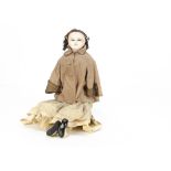 A large mid 19th century English dipped wax over papier-mâché doll, with lever operated sleeping
