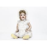 A large Hertel Schwab 99 character baby, with brown sleeping eyes, brown mohair wig, bent-limbed