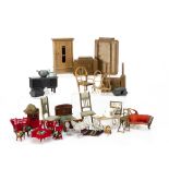 A quantity of dolls' house furniture, including a Britains highchair rocker; a soft metal fronted