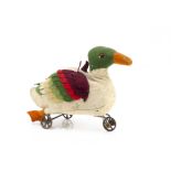 A German early felt duck on wheels circa 1908, the white body with green head, black bead eye with