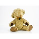 A Merrythought Cheeky teddy bear 1960s, with golden mohair, orange and black plastic eyes, inset