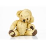 A small Merrythought Cheeky teddy bear 1960s, with blonde mohair/mixed plush, orange and black