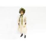 A rare late 19th century poured wax headed shop mannequin, of a girl with light brown inset glass