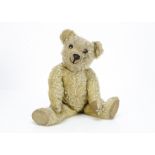 An early Chad Valley Aerolite teddy bear 1920s, with blonde mohair, unusual flat black boot button