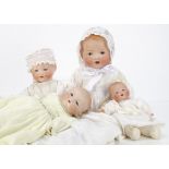 Four Armand Marseill bisque headed babies, the largest 351 with brown sleeping eyes, blonde