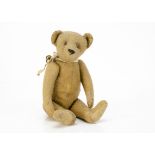 An early German teddy bear 1910-20s, with dark blonde mohair, deeply set clear and black glass