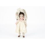 A small Kestner 150 all-bisque child doll, with blue sleeping eyes, brown mohair wig, open/closed