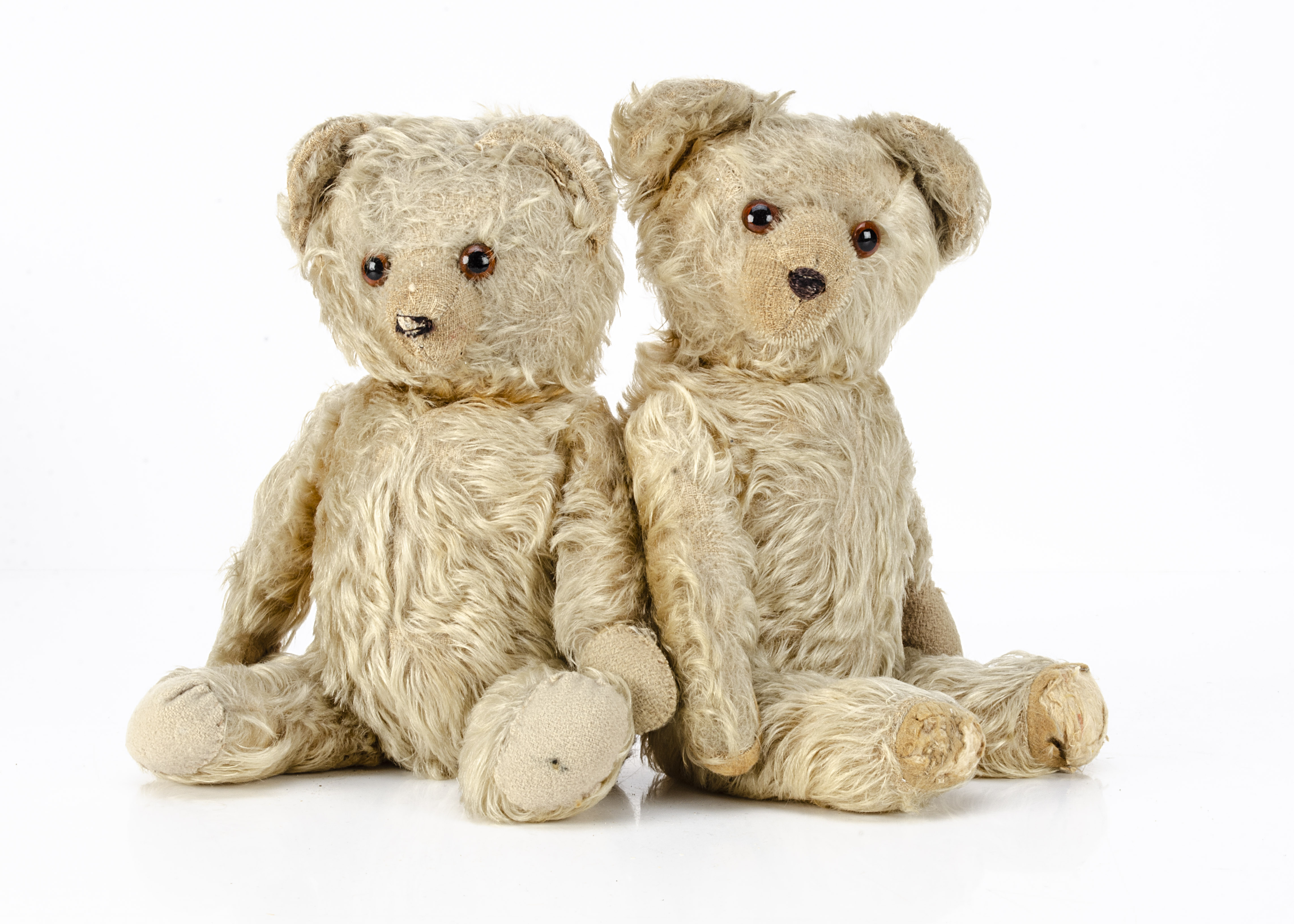 German 1930s teddy bear twins, each with golden mohair, orange and black glass eyes, clipped muzzle,