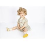 A large Ideal composition Shirley Temple doll, with sleeping eyes, blonde mohair wig, jointed body