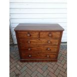 A Victorian mahogany chest of drawers, with three long drawers over two short drawers and turned
