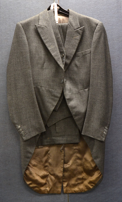 A gentleman's grey cotton tailcoat, with cream lining and matching waistcoat and trousers, a black - Image 3 of 6