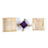 An emery needle cleaner made from the silk velvet used for the purple robes of state from the