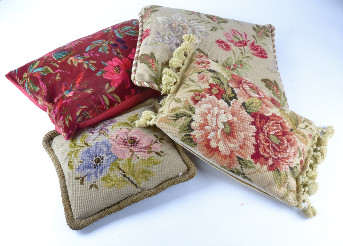 A selection of vintage and contemporary cushions, satin, velvet and woven fabric examples, all