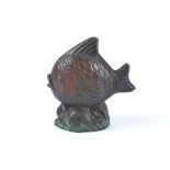 A Danish patinated bronze study of a fish rising above waves, in the style of Just Andersen, with an