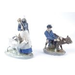 A Royal Copenhagen porcelain figure of a farm boy pulling a cow, no.772, with the printed factory