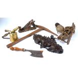 A Black Forest style carved wooden pipe rack of a bird above fruiting vines, 22cm x 37cm