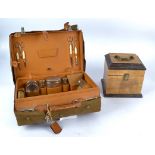 A 20th Century travelling vanity case, brown leather exterior and lining, containing glass