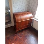 A cylinder top flame mahogany bureau, with three drawers and fitted interior, 98cm x 90cm x 47cm