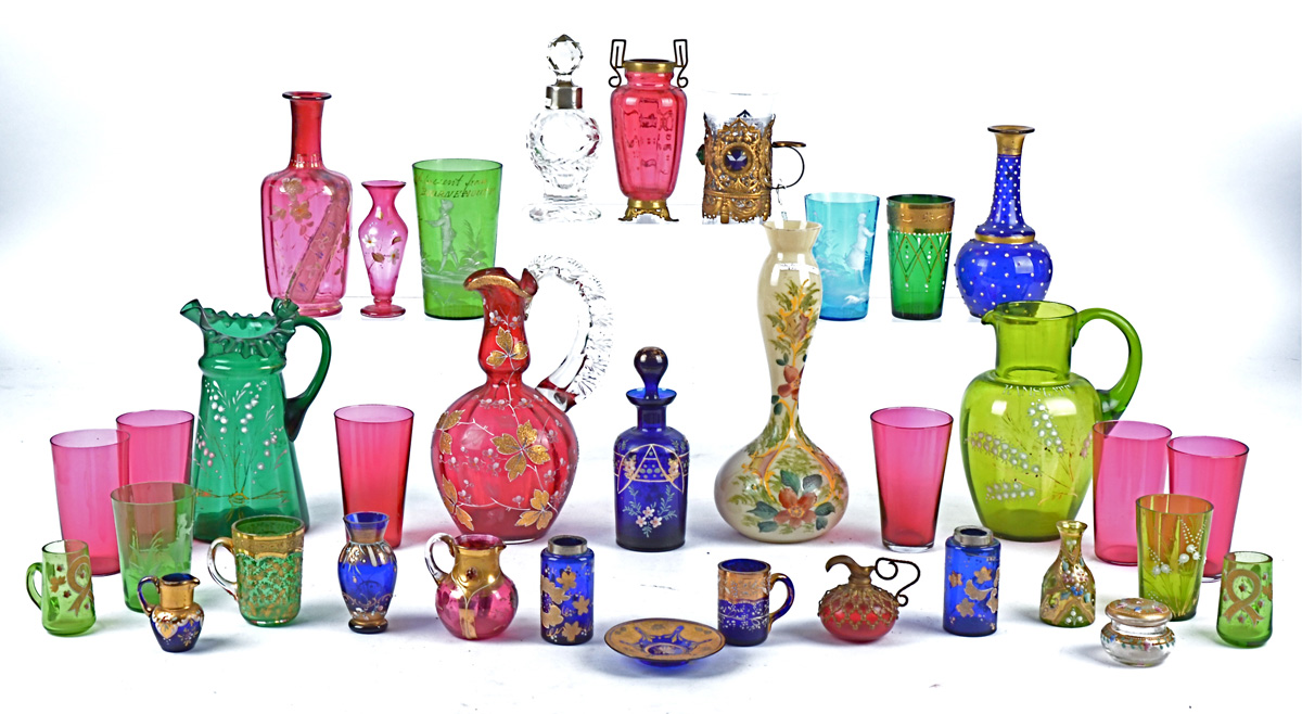 A small collection of ornate Victorian and later glass to include an enamelled green glass jug for