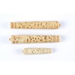 Three 19th Century Canton bone needle cases, all of taped cylindrical form with deep carving of