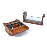 A late 19th Century portable yew writing box opening to reveal sloping compartments and inkwells,