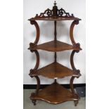 A rosewood four tier whatnot, the corner shelving unit, having pierced design to galleried top, with