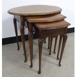 A nest of three tables, having moulded shell design to the tops of the legs, 59cm x 40cm