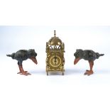 A pair of late 19th or early 20th Century cold painted cast metal candlestick holders taking the