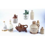 A selection of ceramic and stoneware beverage bottles, including Famous Grouse, Street & Day,
