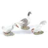 A Royal Copenhagen porcelain model of a goose, number 1068, height 13cm, together with a white duck,