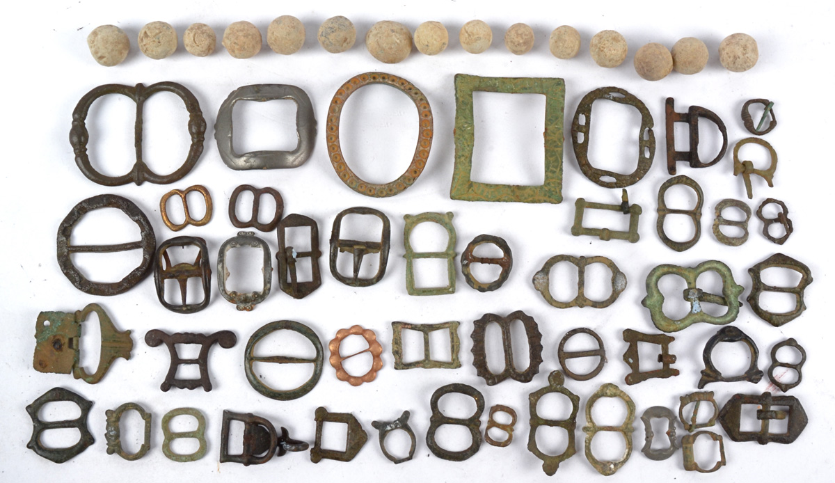 A selection of antique buckles, assorted sizes and designs, together with a quantity of musket balls