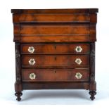 A mahogany apprentice table top chest of drawers, with three drawers with hexagonal glass handles