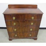 A 19th Century mahogany chest, of two short and three long graduated cock beaded drawers, figural