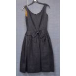 A lady's vintage 1950's Harrods dress, from the Création de Paris series, black fabric with a