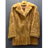 A 1940's lady's vintage three quarter length musket fur coat, brown satin lining, length 81cm, width