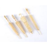 Three Victorian bone needle cases incorporating stanhopes, all modelled as furled umbrellas,