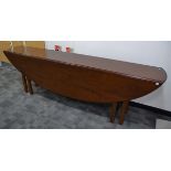 An 18th Century style mahogany oval gateleg coffin or wake table, double gate leg action with reeded