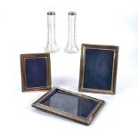 Three contemporary hallmarked silver photograph frames, the largest 24cm x 18.5cm, together with two