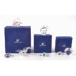 Seven Swarovski Crystal sea life figures, including two shells, a starfish, three fish and a pair of