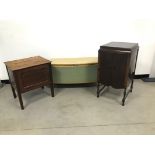 Three pieces of furniture, including a Lloyd Loom style blanket chest, a pot cupboard and a small