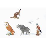 Four Beswick ceramic animal figures, including a Kestrel (model no. 2316), an Owl (model no.