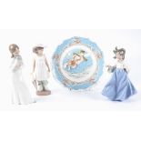 Three Spanish Nao porcelain figures of young ladies, one a girl with a dove, another a girl with a