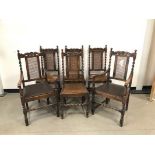 A set of six reproduction oak Carolean dining chairs, rattan back supports and drop in vinyl