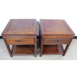 A pair of 20th Century Chinese hardwood side tables, square tops with undershelf, single frieze