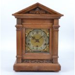 A early 20th Century German mantle clock, polished brass dial with Arabic numerals, movement by